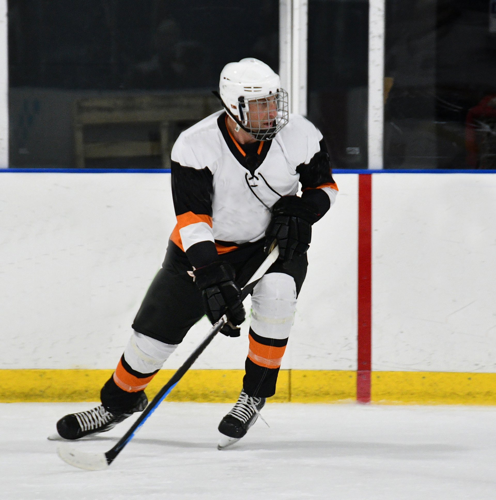 Hockey player skating aggressively